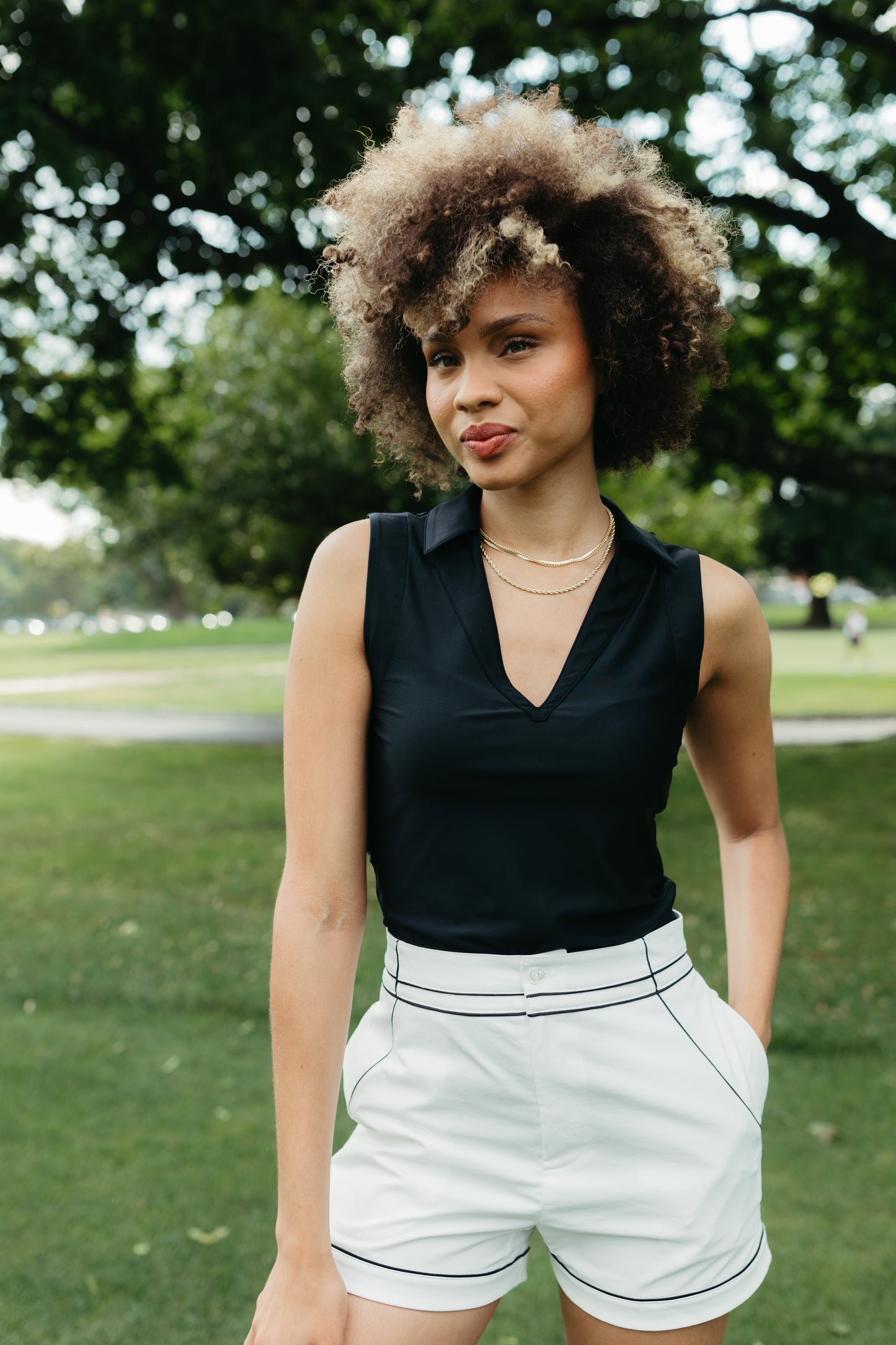 women's 4-way stretch v neck for golf and tennis. athletic collared tank. country club outfit. resort wear
